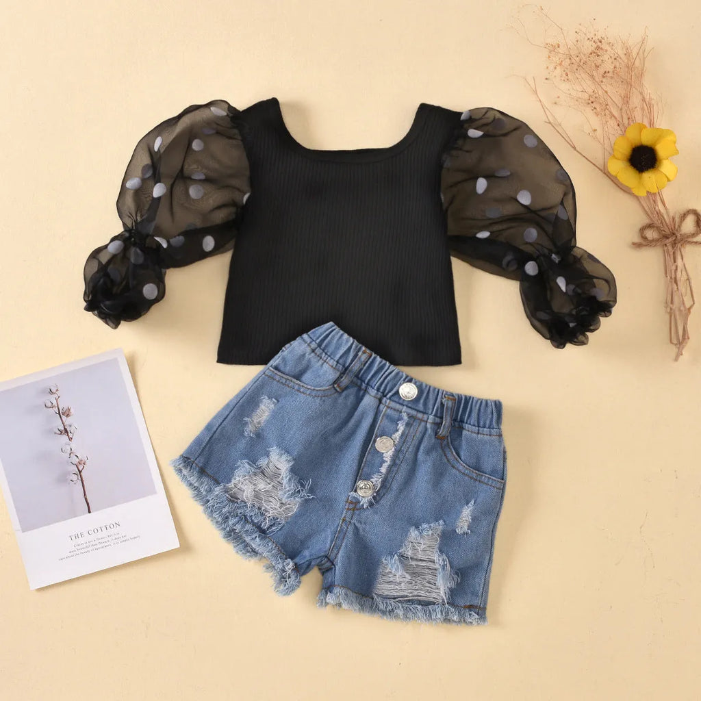 Children's black cotton mesh long sleeve top with dot detailed sleeves and ripped denim shorts suit set
