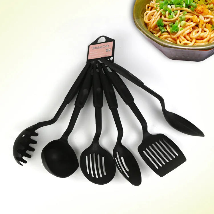 Black silicone kitchen utensil set with serving shovel and mixing spoon for non-stick pans