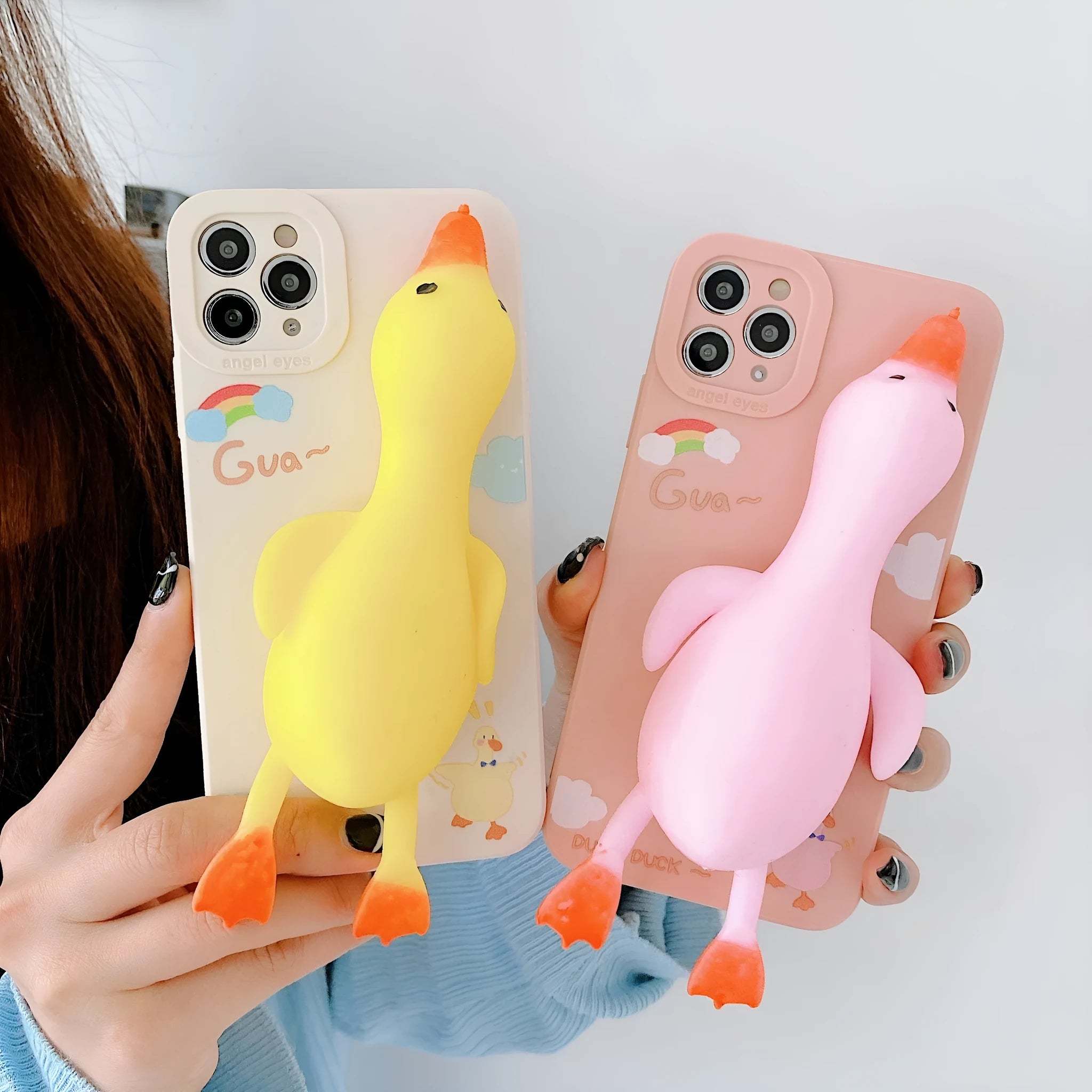 Cartoon printed silicone back cover case for iPhone on a yellow background.