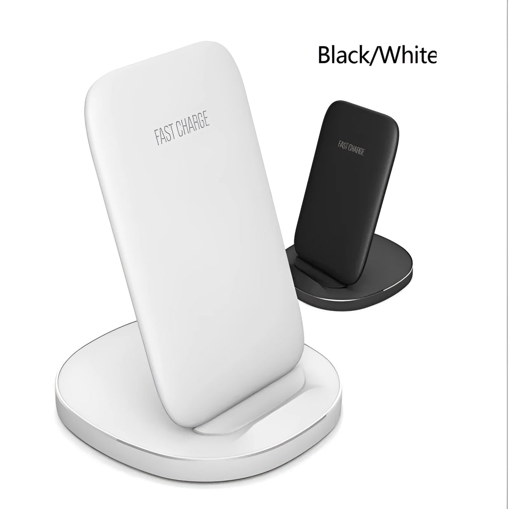 A white minimalist vertical wireless charging stand holding a smartphone upright on a desk.
