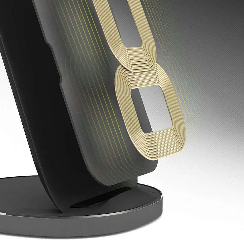 A white minimalist vertical wireless charging stand holding a smartphone upright on a desk.