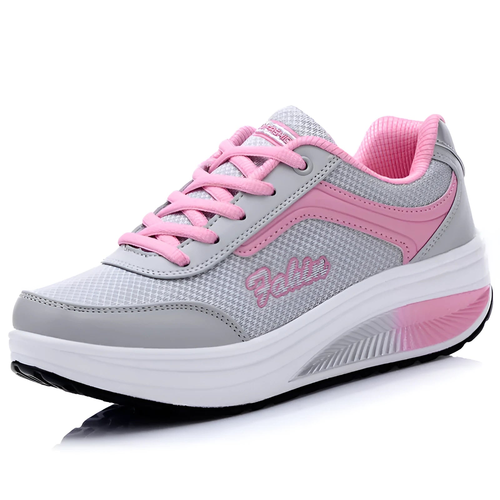 Women's grey and pink sports shoes with a middle heel on a plain background