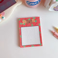 Kawaii cartoon bear design memo pad notepad with colourful cover, open to show paper pages.