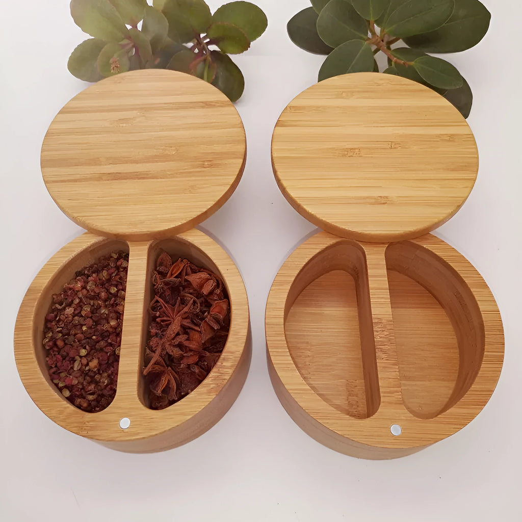 Bamboo seasoning storage box with a matching bamboo spoon on a kitchen counter.