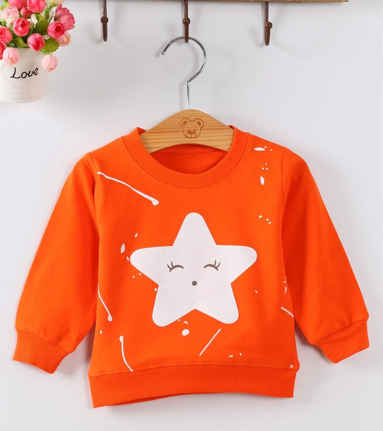 Korean-style baby girls' autumn sweater with cartoon pattern and ruffle sleeves in sizes 70-100cm