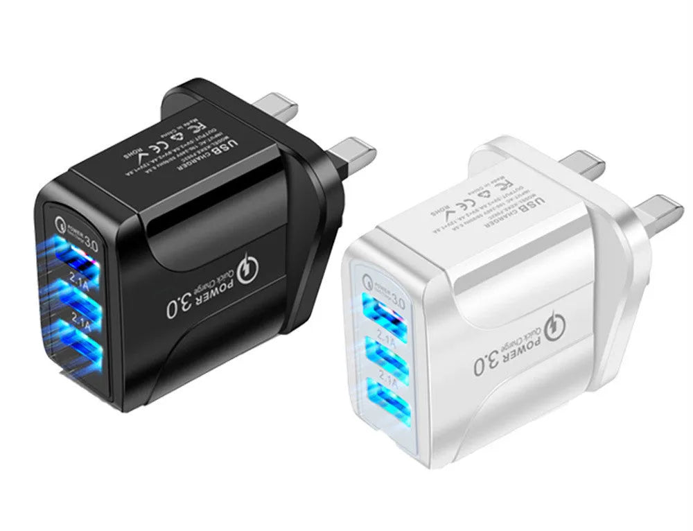 Black QC3.0 fast travel charger with three USB ports and a UK triangular plug attached.