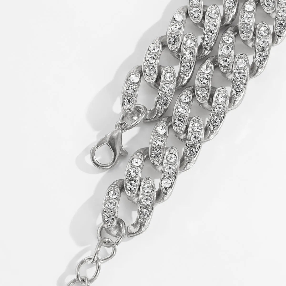 Women's snake bone chain bracelet in electroplated gold or silver metal with geometric retro style links