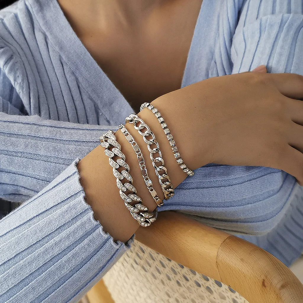Women's snake bone chain bracelet in electroplated gold or silver metal with geometric retro style links