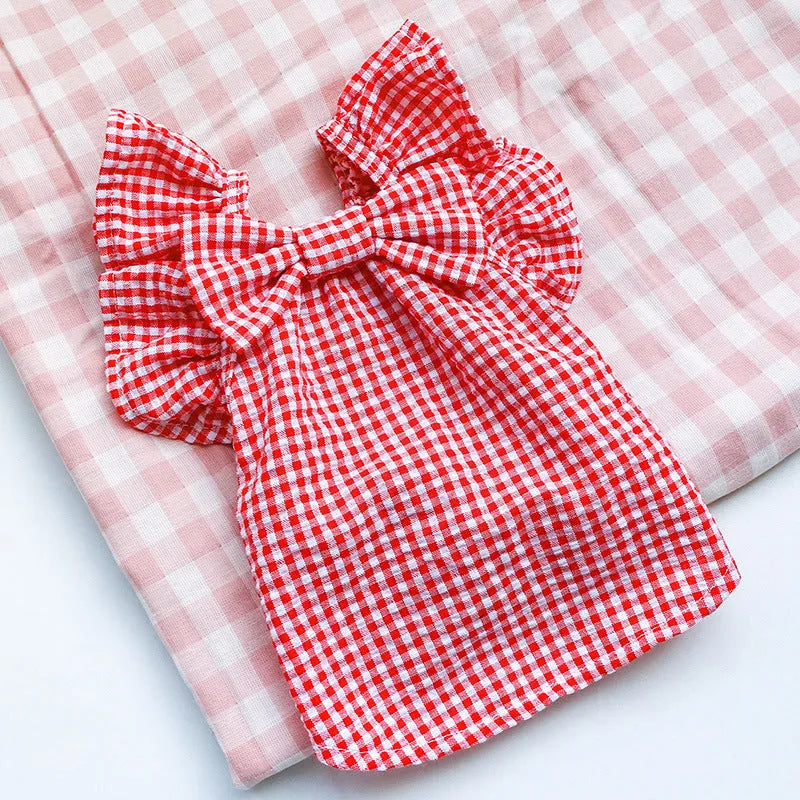 Red check bowknot pet shirt on small dog, casual polyester outfit in red with bowknot detail