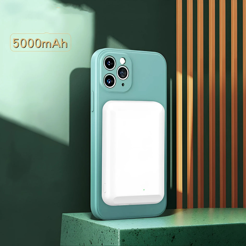 A black magnetic wireless power bank with a 5000mAh capacity on a table.