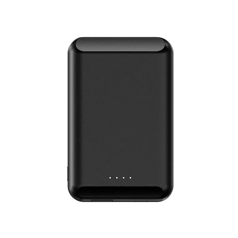 A black magnetic wireless power bank with a 5000mAh capacity on a table.