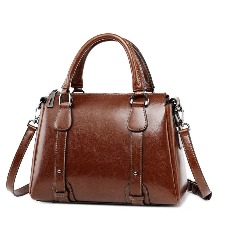 Two-layer cowhide leather women's shoulder handbag with zip opening and internal pockets