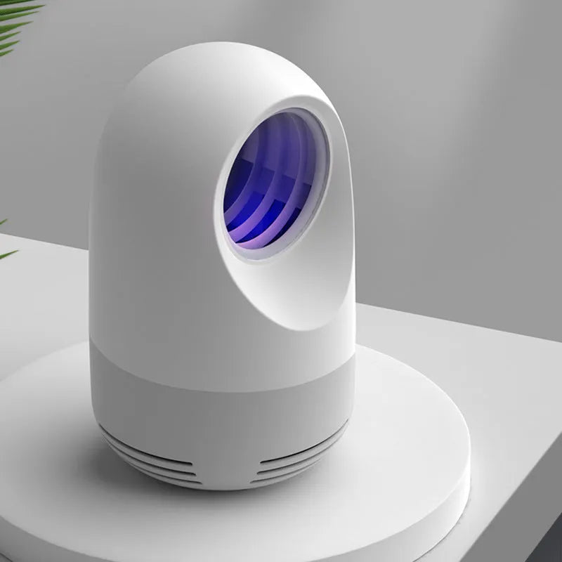 Photocatalyst mosquito killer lamp with bionic UV light and USB cable on desktop