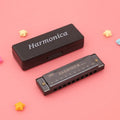 Children's Orff harmonica educational toy in black box with gold, red and silver colour options