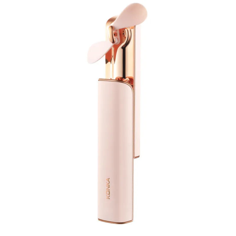 Pink folding handheld electric fan with USB charging port and mechanical speed controls