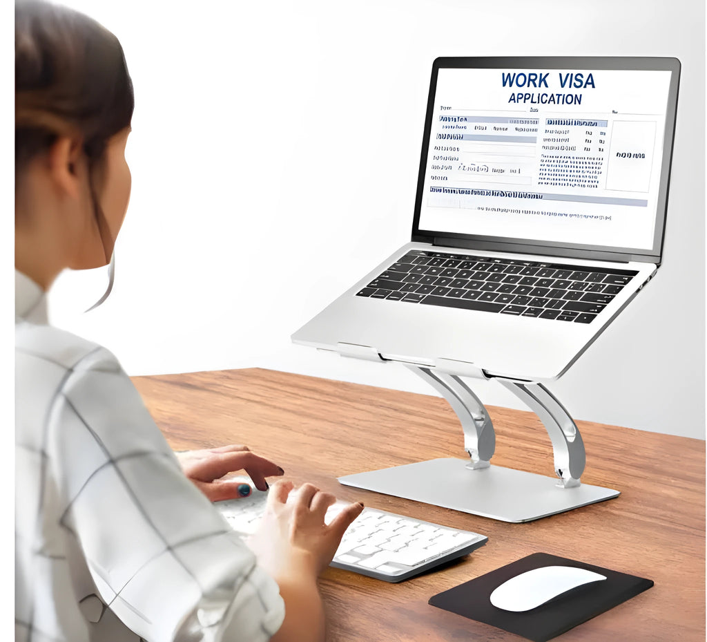 Aluminium alloy folding laptop stand in gray with open-frame cooling base, angled for use