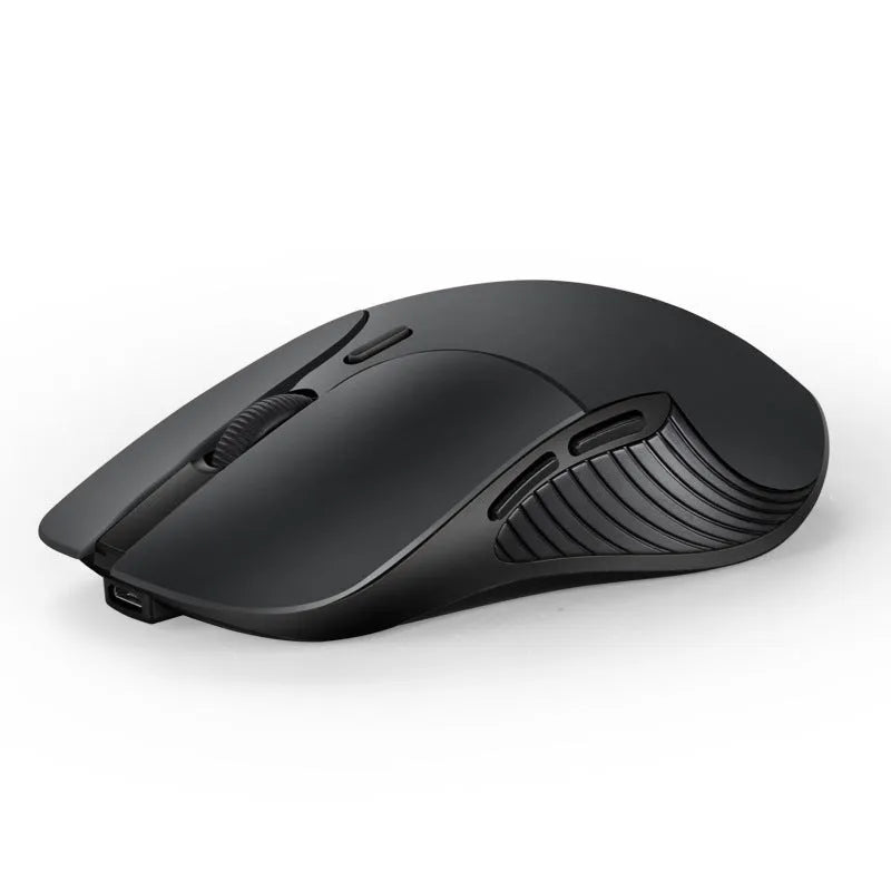 Blue wireless computer mouse with voice translation feature on a desk.