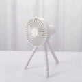 Small portable desktop fan with bendable neck on an octopus tripod, showing black, green, pink, and white colour options.