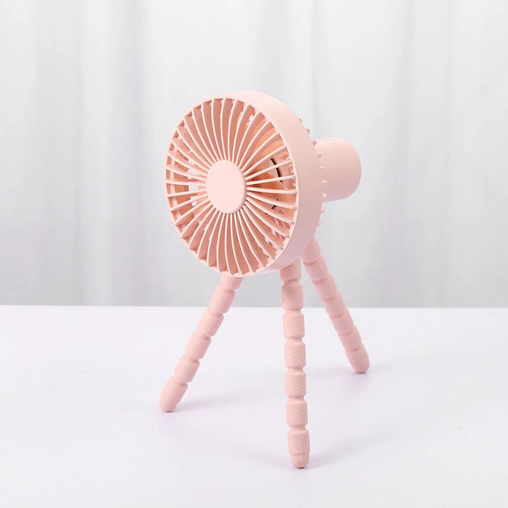 Small portable desktop fan with bendable neck on an octopus tripod, showing black, green, pink, and white colour options.