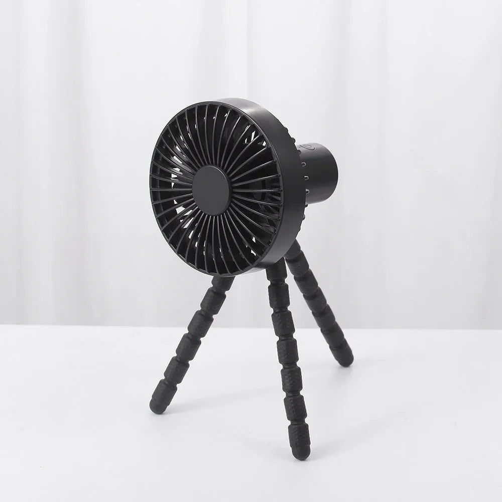 Small portable desktop fan with bendable neck on an octopus tripod, showing black, green, pink, and white colour options.