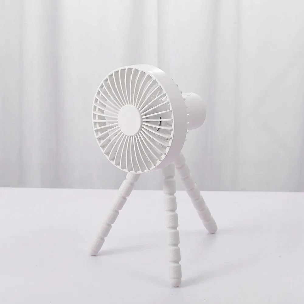 Small portable desktop fan with bendable neck on an octopus tripod, showing black, green, pink, and white colour options.