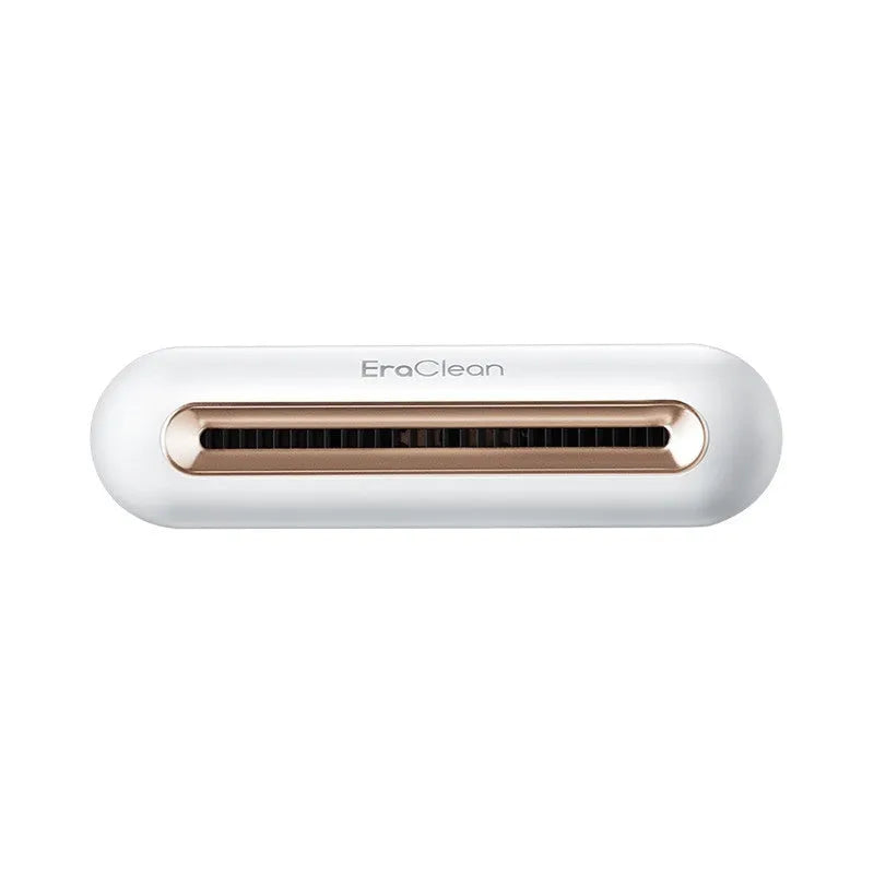 Rose gold USB car air purifier and deodoriser unit for small spaces.