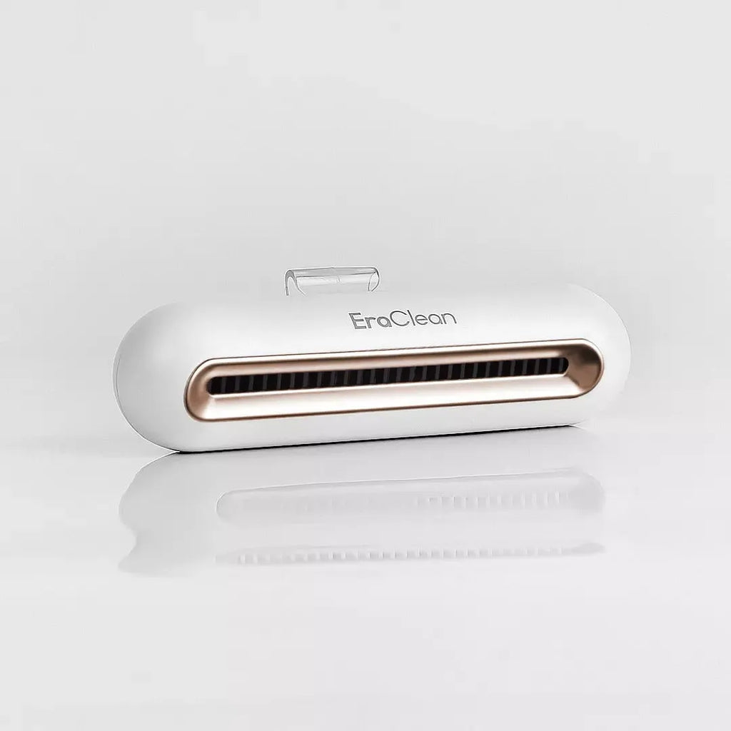 Rose gold USB car air purifier and deodoriser unit for small spaces.