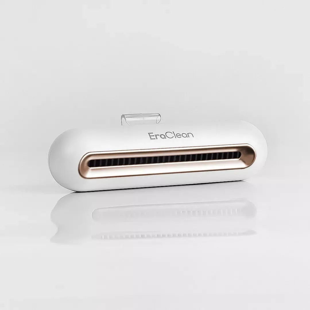 Rose gold USB car air purifier and deodoriser unit for small spaces.