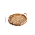 Round handwoven rattan storage basket with wooden handle and fabric lining in three size options.