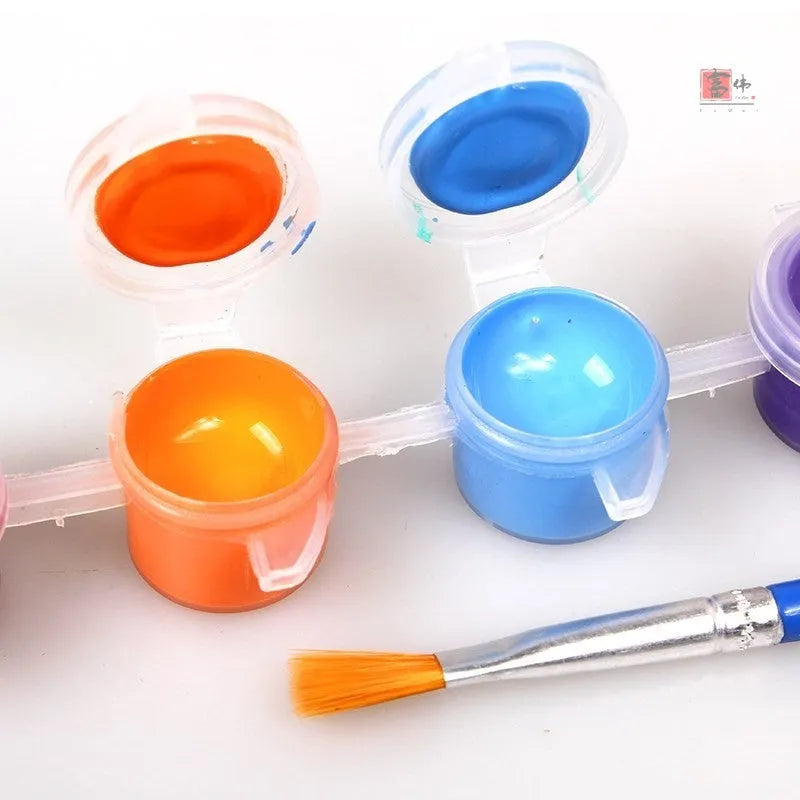 Children's gouache painting set showing 50 pre-printed boards, 8 rows of pigments, 8 pens, and a palette on a table.