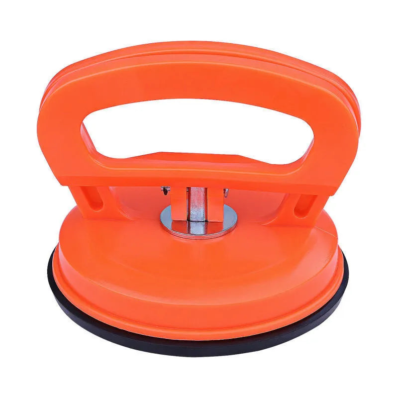 PDR car dent repair tool with large orange suction cup and plastic handle