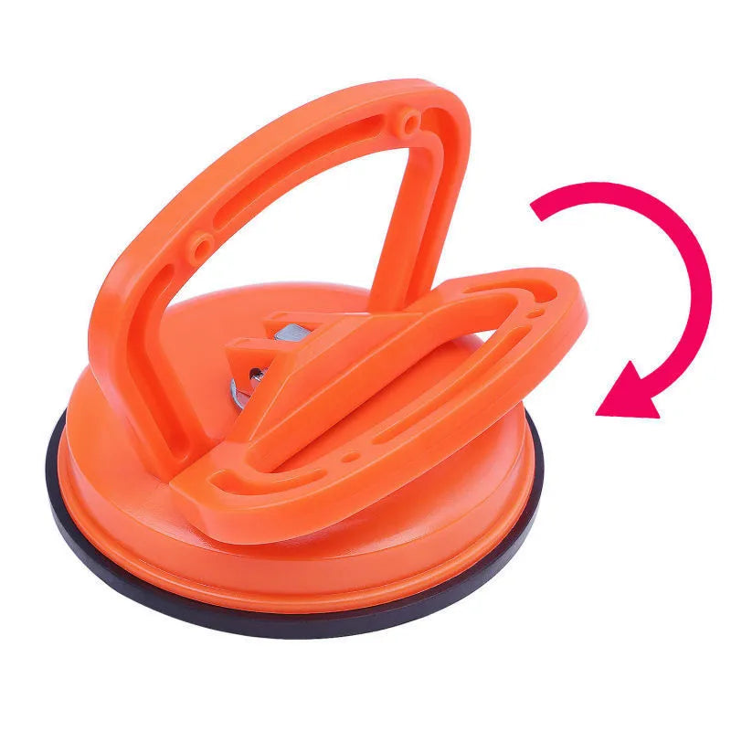PDR car dent repair tool with large orange suction cup and plastic handle
