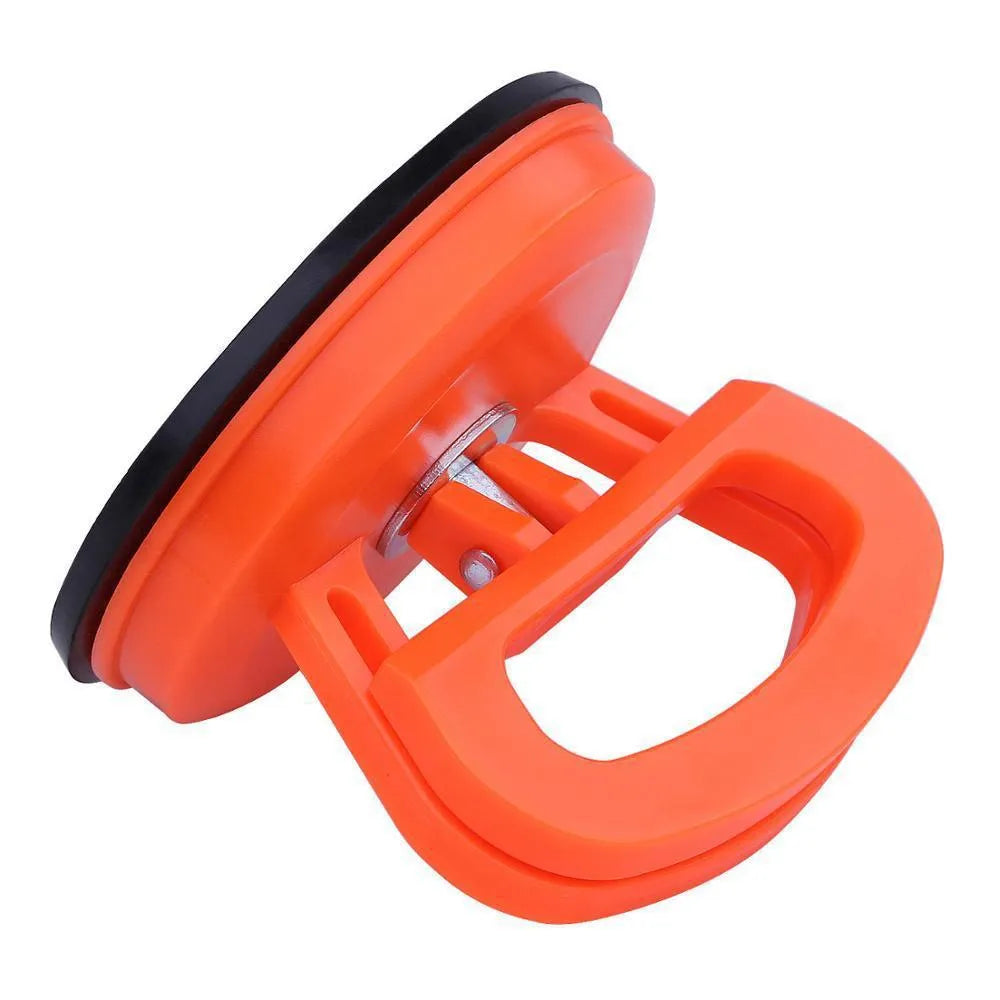 PDR car dent repair tool with large orange suction cup and plastic handle