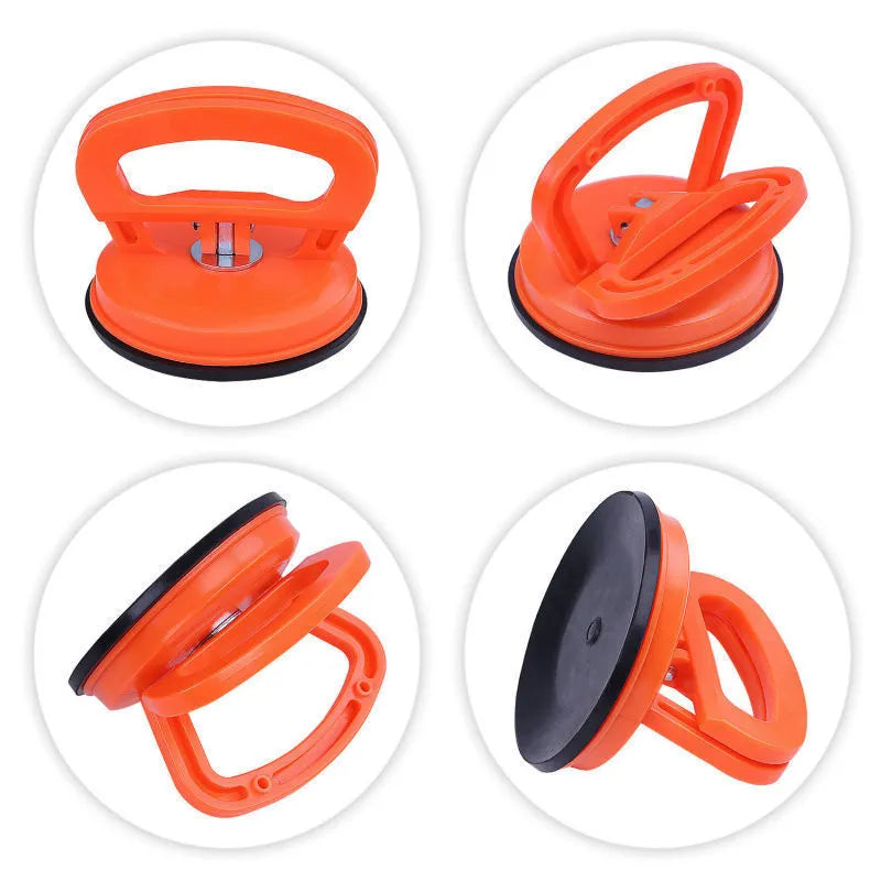 PDR car dent repair tool with large orange suction cup and plastic handle