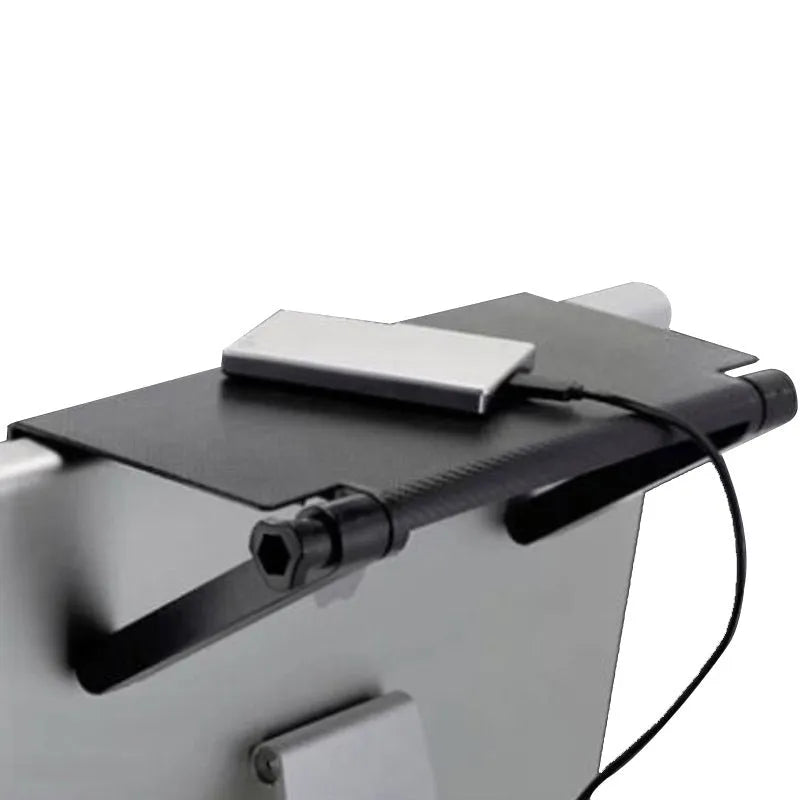 Plastic desktop storage rack holding a TV set-top box and router, showing cable routing through its free punching design.