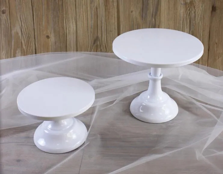 Three-tiered metal dessert tray with cake and fruit on 25cm wide sections in gold colour.