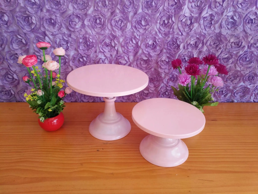 Three-tiered metal dessert tray with cake and fruit on 25cm wide sections in gold colour.
