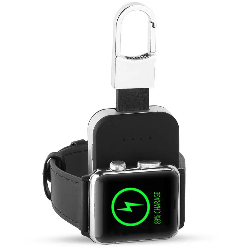 Black Apple Watch portable power bank keychain charger on a keyring.