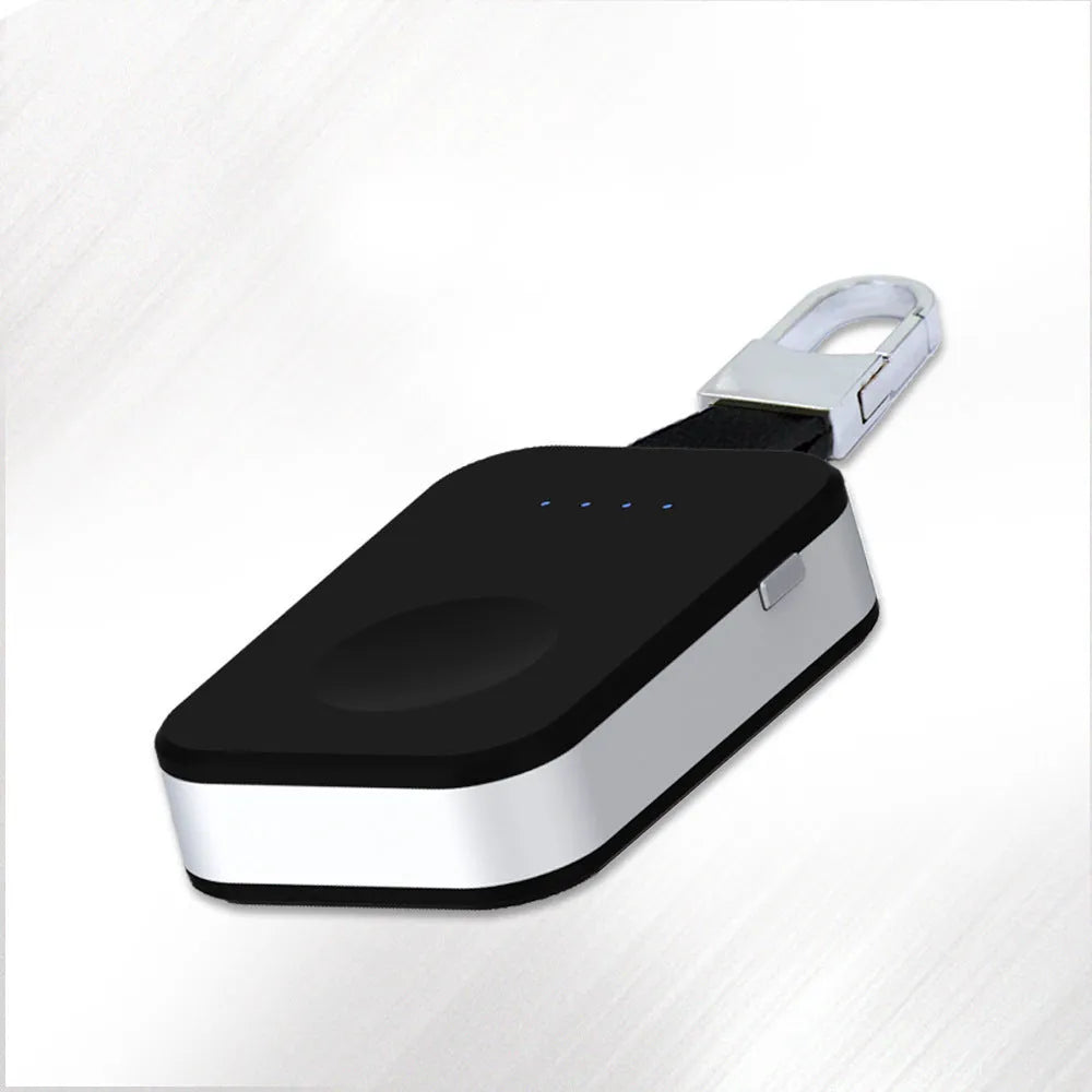 Black Apple Watch portable power bank keychain charger on a keyring.