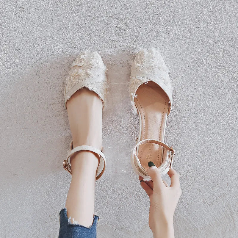 Women's apricot suede d'Orsay flats with an ankle strap and a low heel.