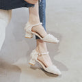 Women's apricot suede d'Orsay flats with an ankle strap and a low heel.