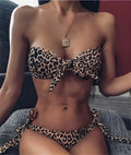 Women's leopard print bikini swimsuit two piece with chest pads and polyester fabric on display.