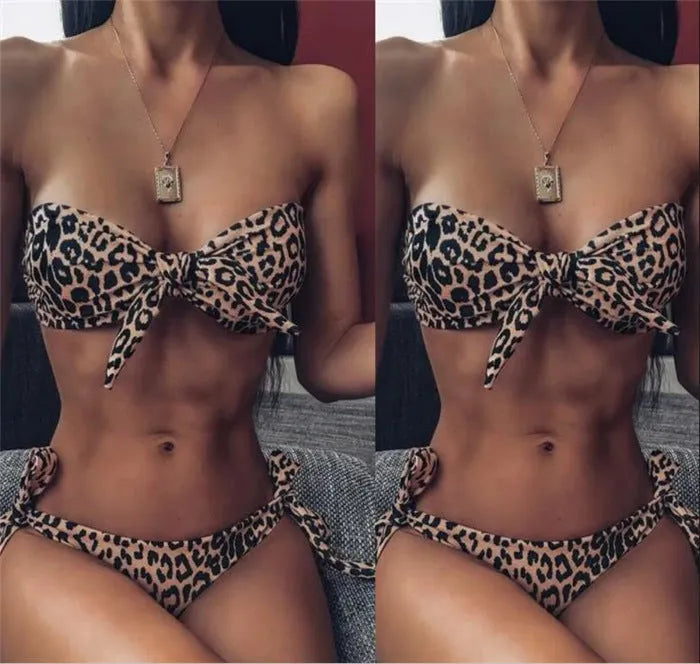 Women's leopard print bikini swimsuit two piece with chest pads and polyester fabric on display.