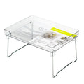 White plastic kitchen supplies rack on a countertop holding spice jars.