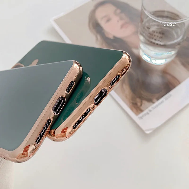 Simple solid colour TPU back cover case for iPhone on a table, shown in Blue.