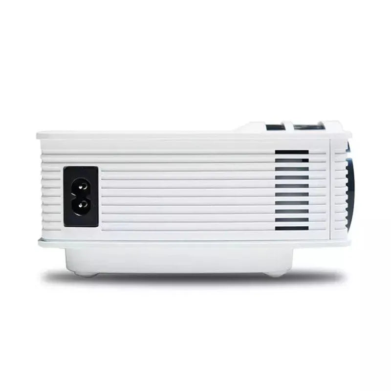 White home projector with LED lens on a table, showing a bright projected image on a wall