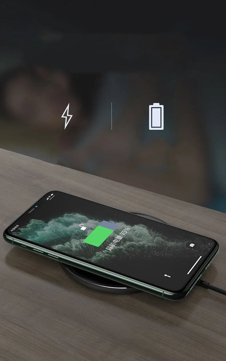 Black Kuulaa KL-CD16 wireless charging disc for mobile phones on a surface