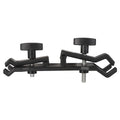 Black ABS plastic umbrella clip for mounting on a camera tripod quick release plate.