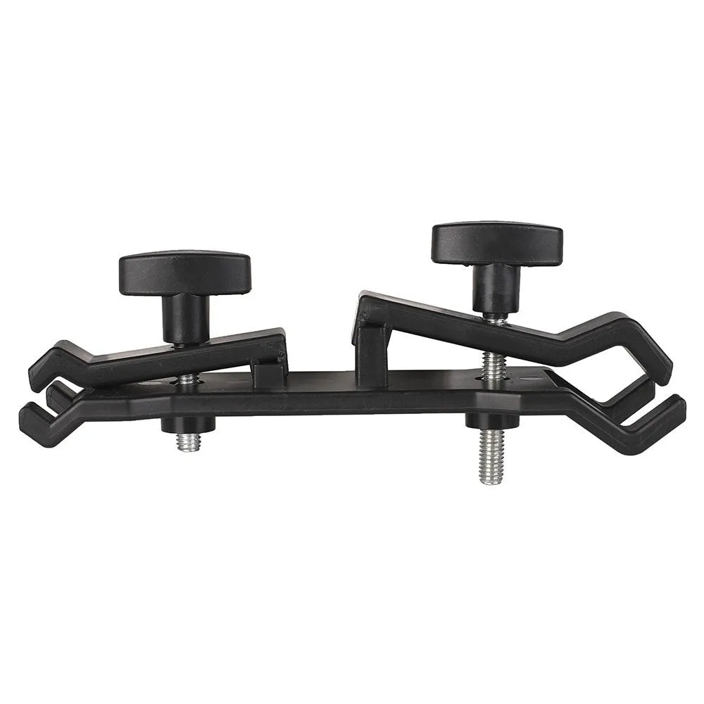 Black ABS plastic umbrella clip for mounting on a camera tripod quick release plate.