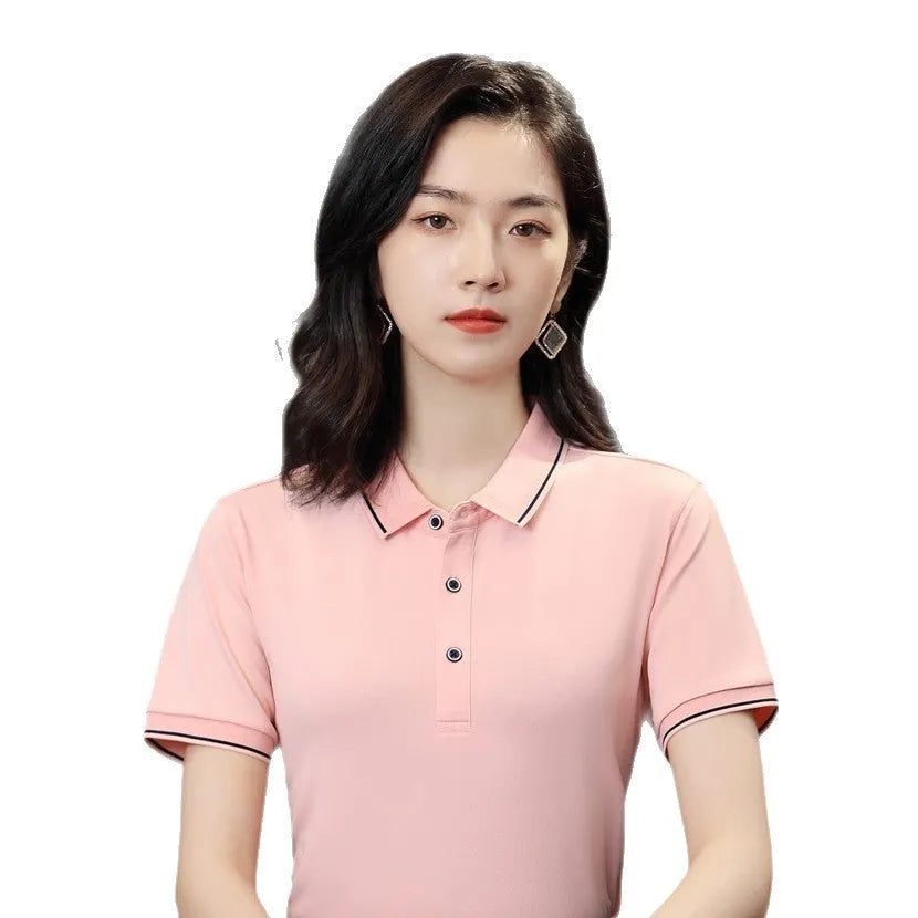 Short-sleeved beautician work polo shirt in cool silk cotton on a hanger, showing asymmetric detail and collar.